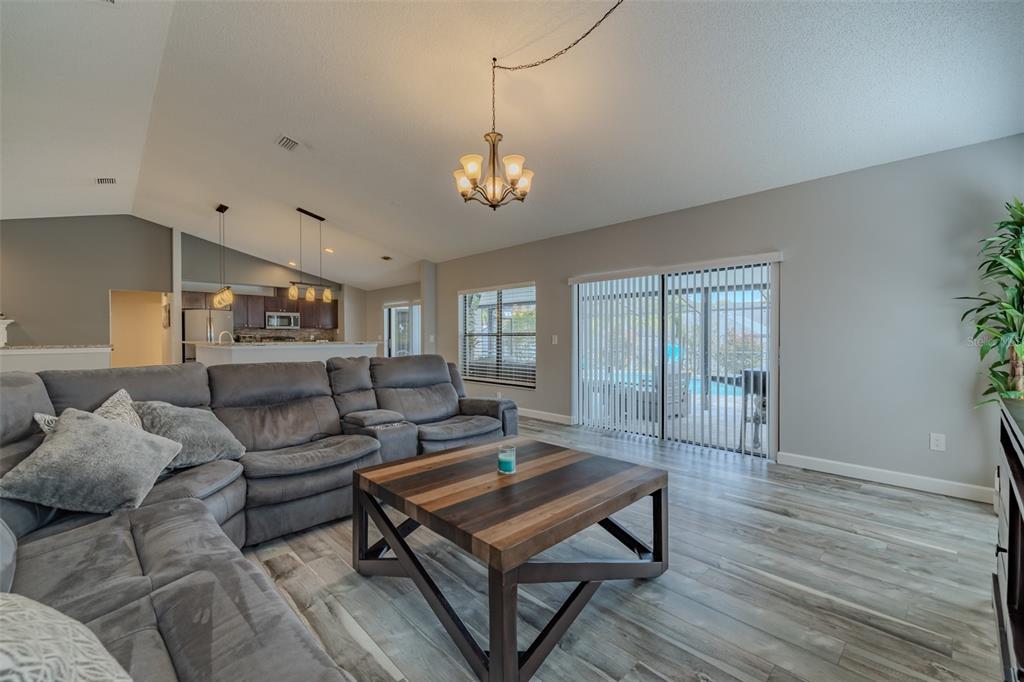 222 Halton Circle Seffner, FL 33584 - Photo 23 of 57 a living room with furniture a ceiling fan and a rug