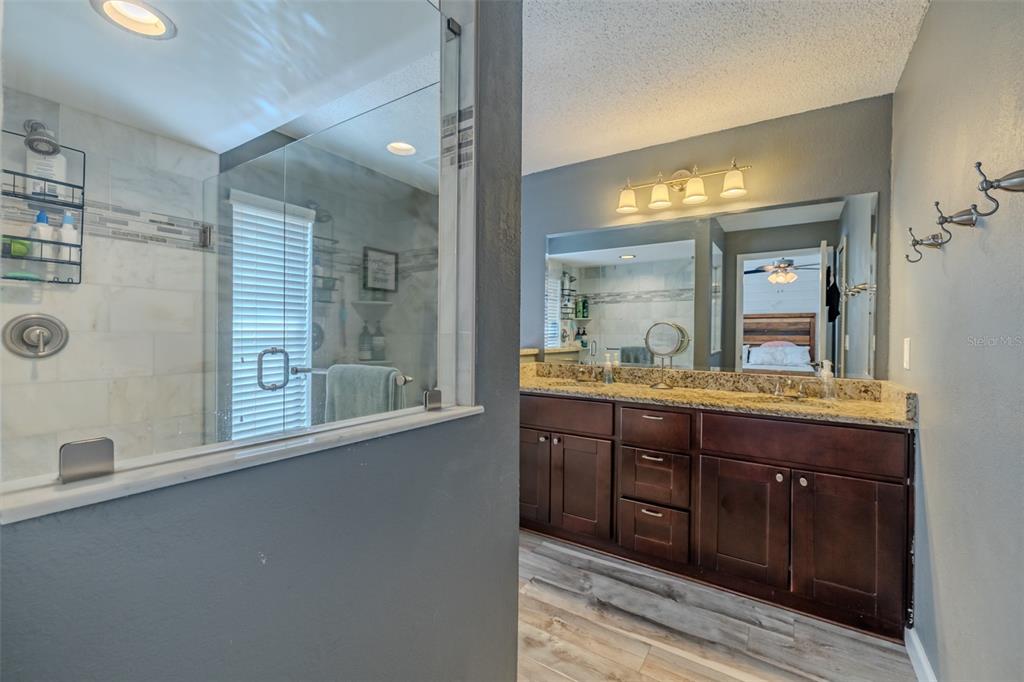 222 Halton Circle Seffner, FL 33584 - Photo 29 of 57 a bathroom with a granite countertop sink mirror and double