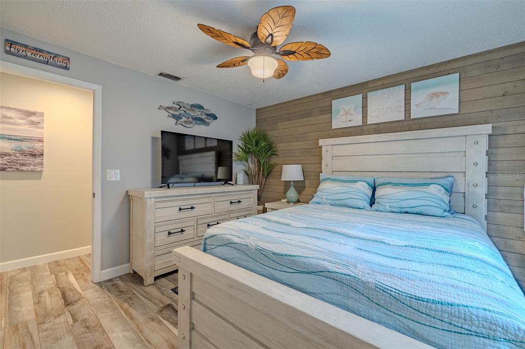 222 Halton Circle Seffner, FL 33584 - Photo 32 of 57 a bedroom with a bed and a flat screen tv