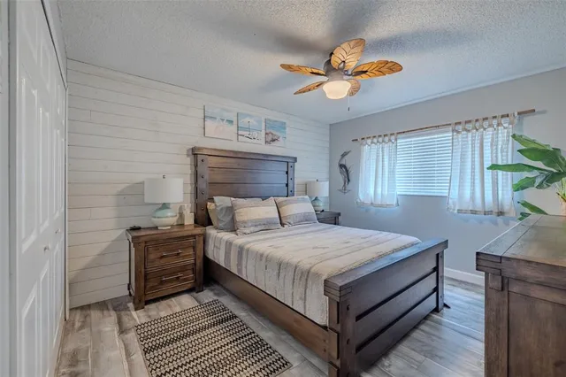 a bathroom with a granite countertop sink mirror vanity and toilet