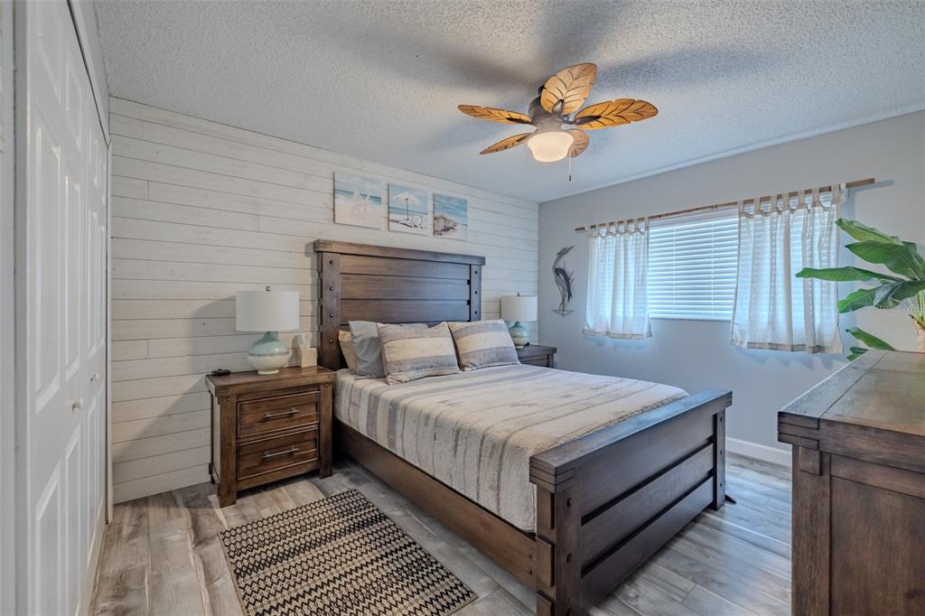 222 Halton Circle Seffner, FL 33584 - Photo 33 of 57 a bedroom with a bed and a chandelier