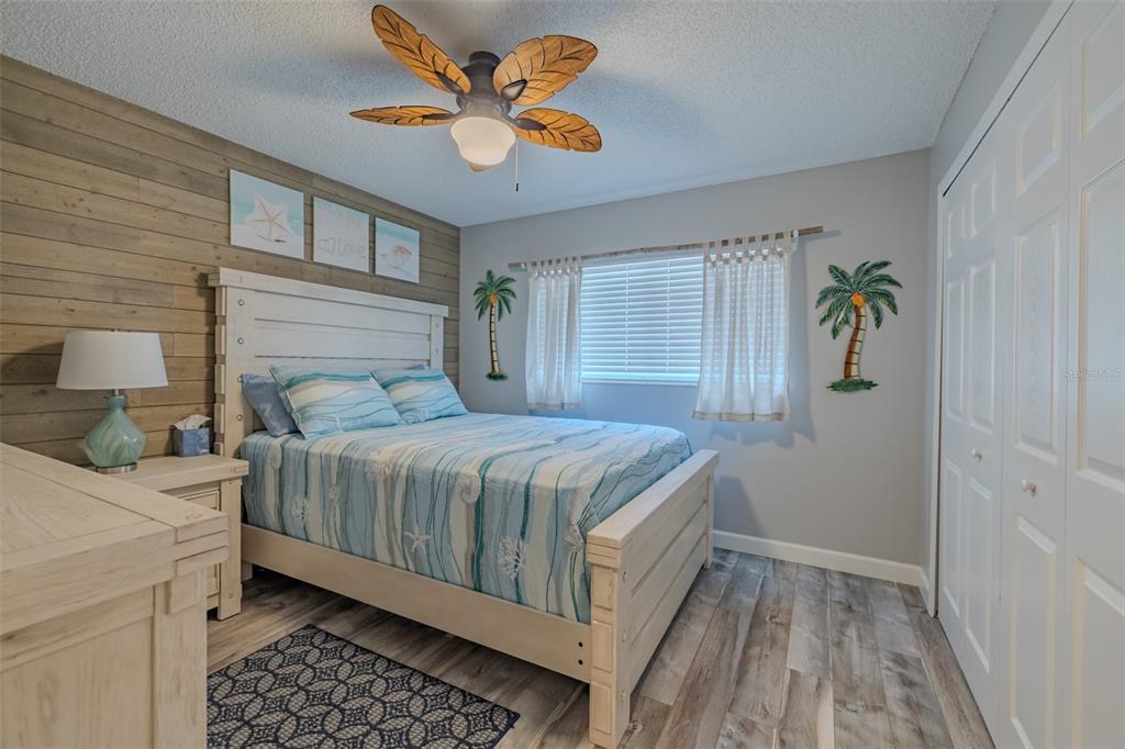 222 Halton Circle Seffner, FL 33584 - Photo 35 of 57 a bedroom with a bed and a chandelier