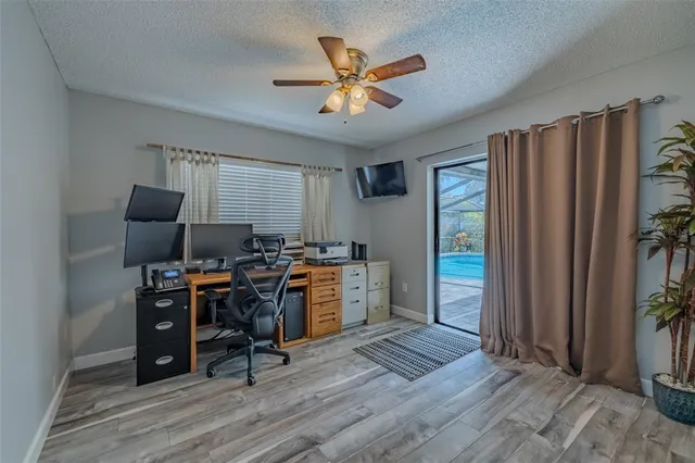 a view of a swimming pool with a patio