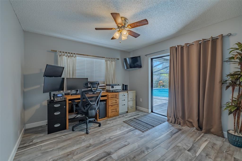 222 Halton Circle Seffner, FL 33584 - Photo 36 of 57 a view of a workspace with furniture and a window