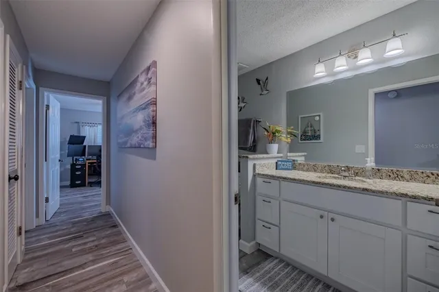 a view of a swimming pool with outdoor seating