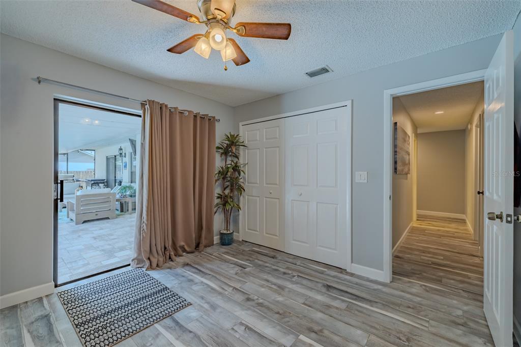 222 Halton Circle Seffner, FL 33584 - Photo 38 of 57 wooden floor in an empty room with a mirror
