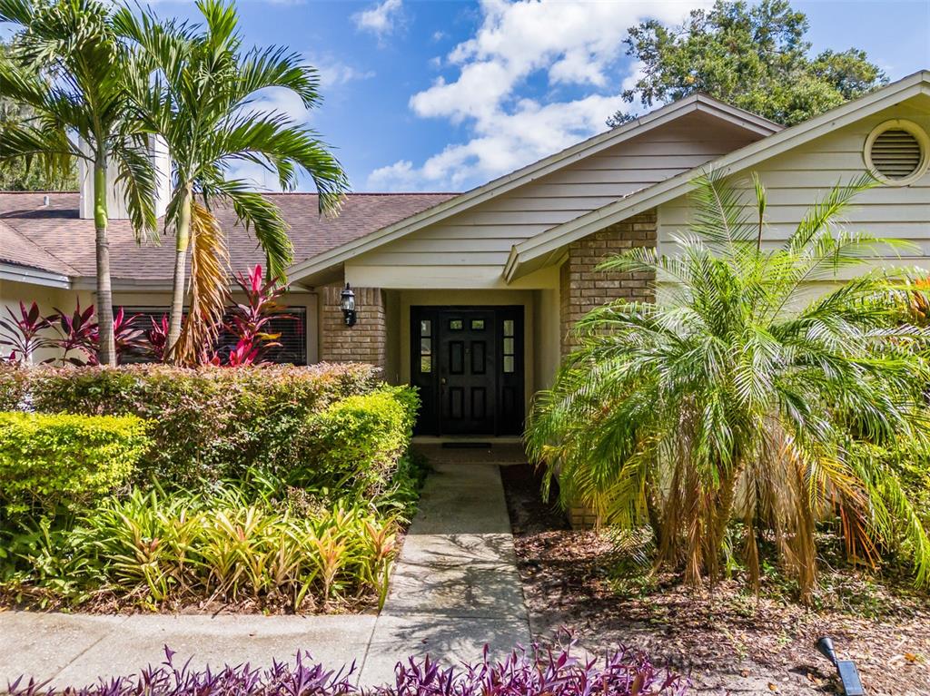 222 Halton Circle Seffner, FL 33584 - Photo 6 of 57 a front view of a house with garden