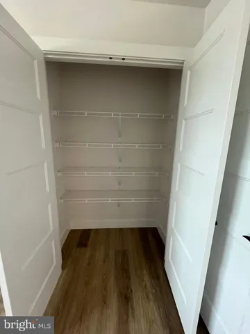 a bathroom with a double vanity sink toilet mirror and shower