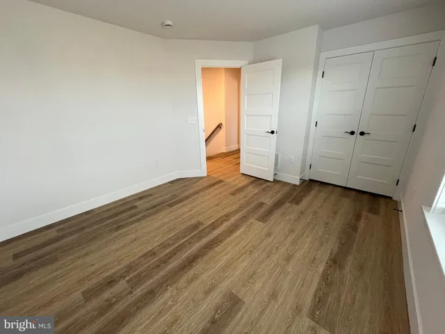 a view of a empty room with wooden walls