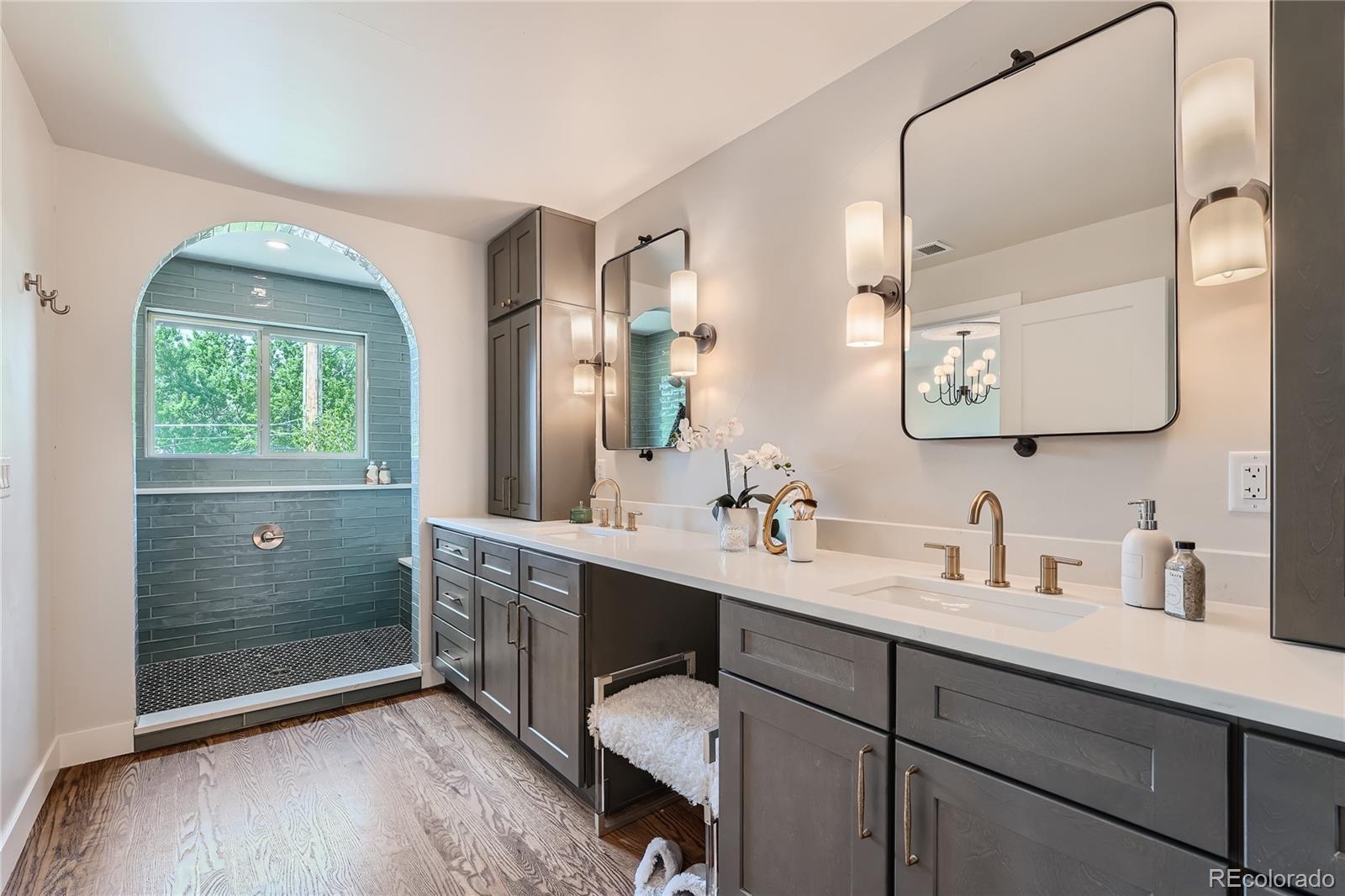 1908 East Street Golden, CO 80401 - Photo 21 of 50 a bathroom with a double vanity sink mirror and shower