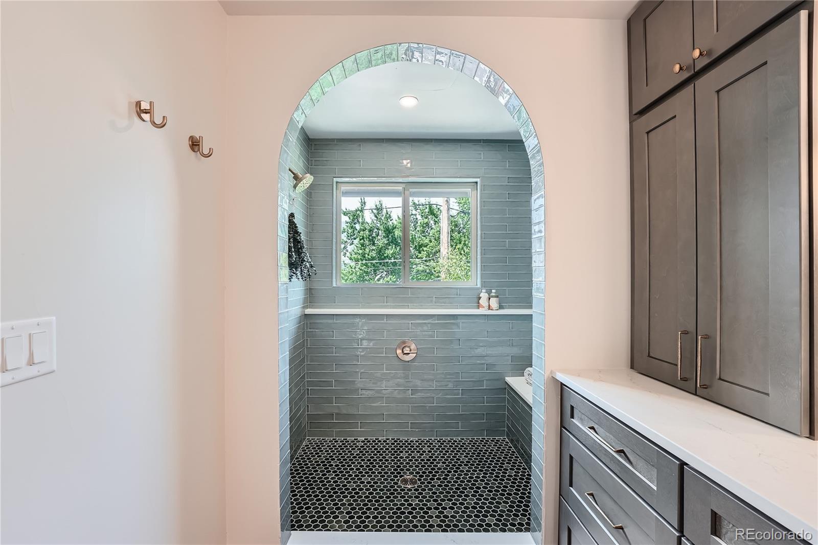 1908 East Street Golden, CO 80401 - Photo 22 of 50 a bathroom with a sink shower and a mirror