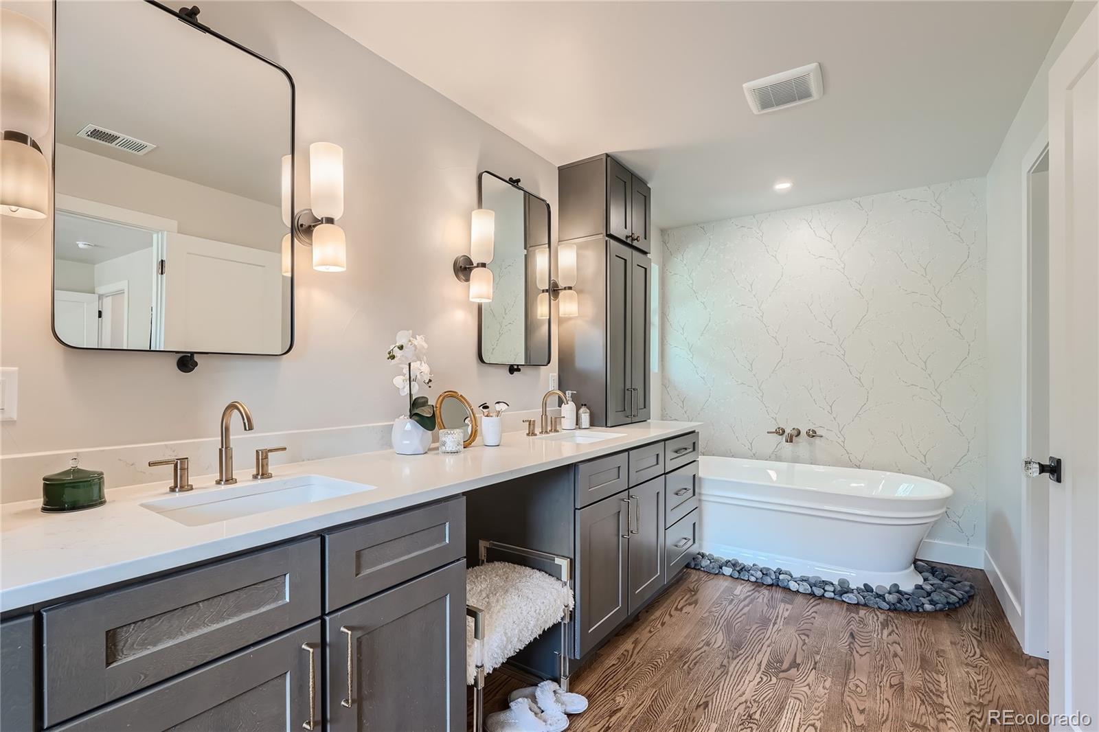 1908 East Street Golden, CO 80401 - Photo 23 of 50 a bathroom with a toilet sink double vanity and mirror