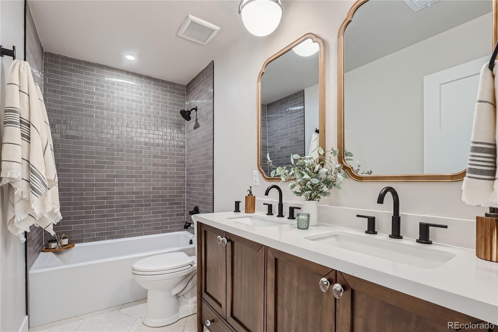 1908 East Street Golden, CO 80401 - Photo 26 of 50 a bathroom with a sink a toilet and shower