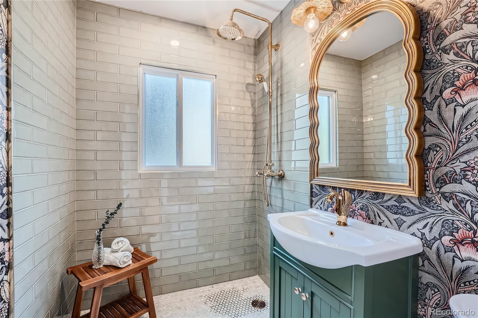 1908 East Street Golden, CO 80401 - Photo 37 of 50 a bathroom with a sink and a mirror