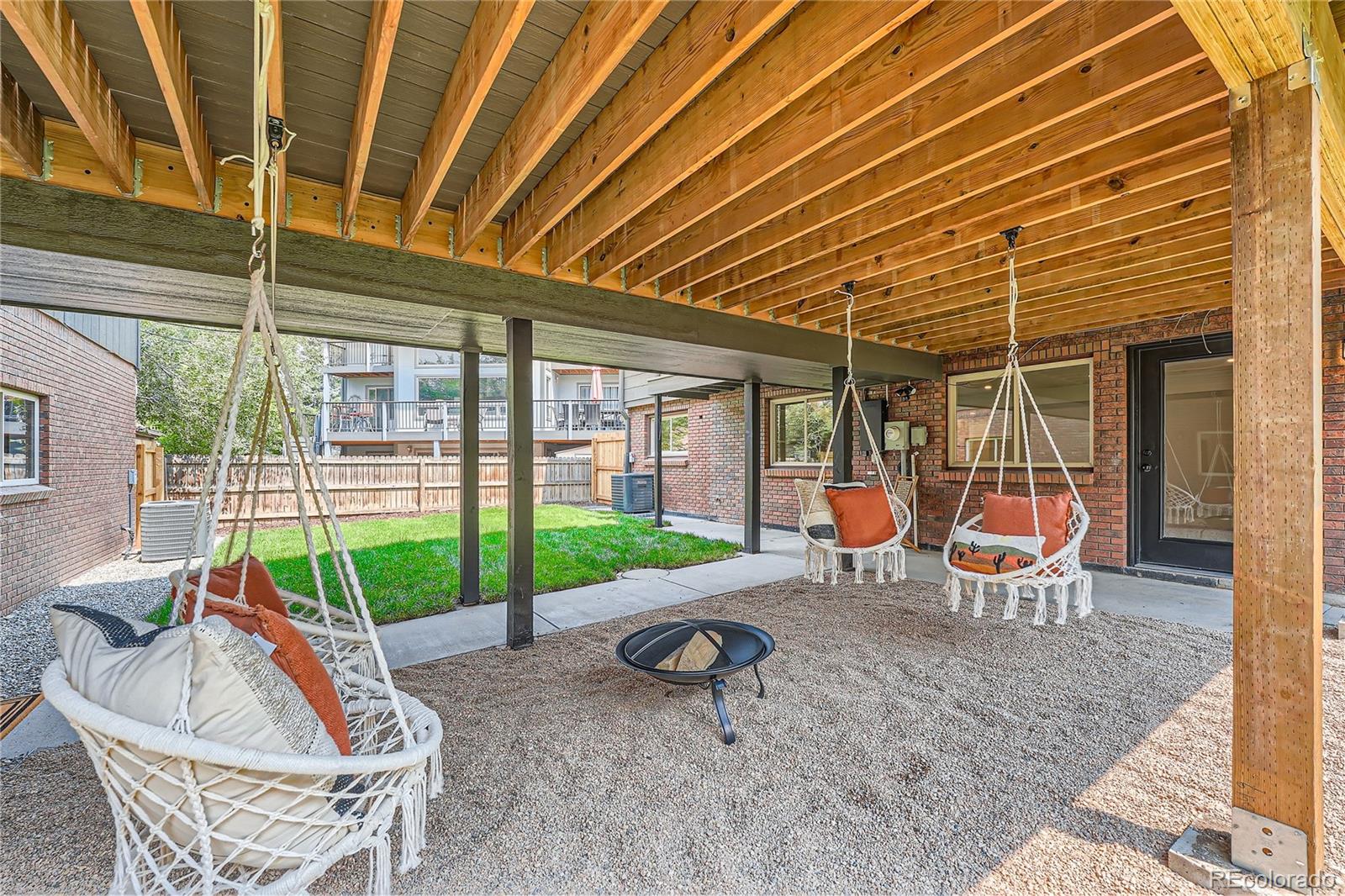 1908 East Street Golden, CO 80401 - Photo 47 of 50 a view of a backyard with table and chairs and wooden fence
