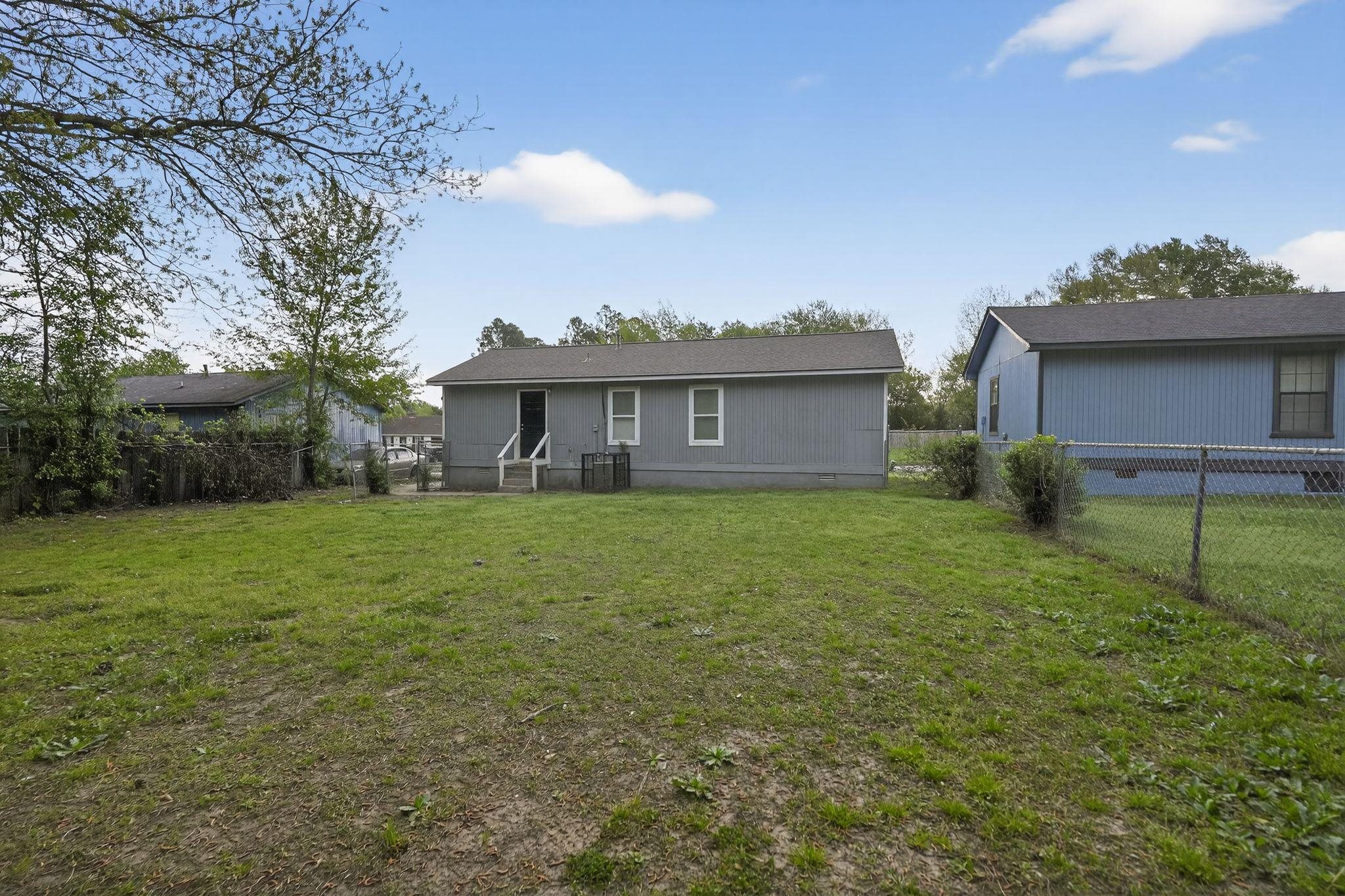 4725 Lofts Road Memphis, TN 38118 - Photo 29 of 32 Back of property with a fenced backyard and crawl space