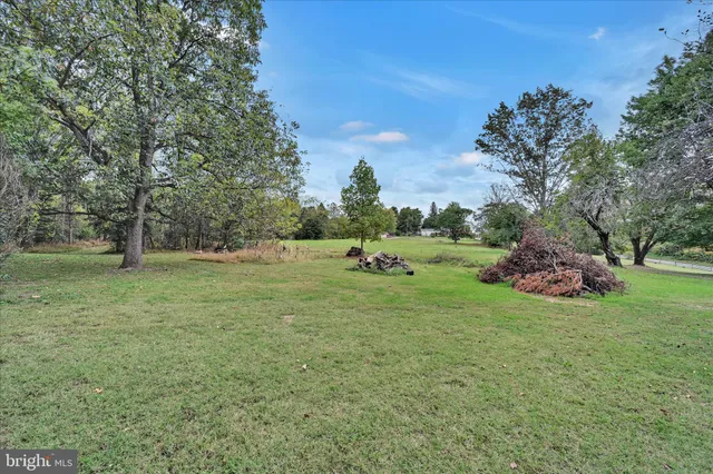 a view of outdoor space with deck and yard
