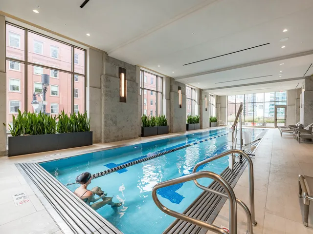 a view of swimming pool with furniture