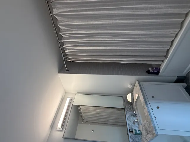 a group of cars parked in front of a house