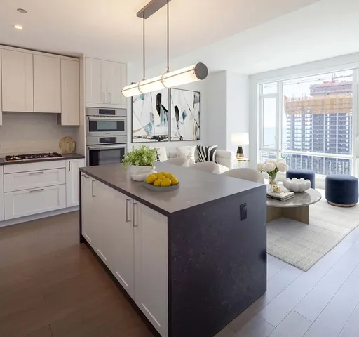 a kitchen with a stove a sink and a refrigerator