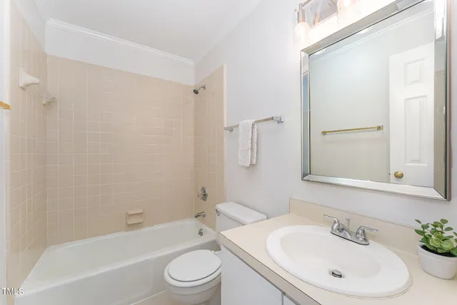 a bathroom with a toilet a sink and a bathtub