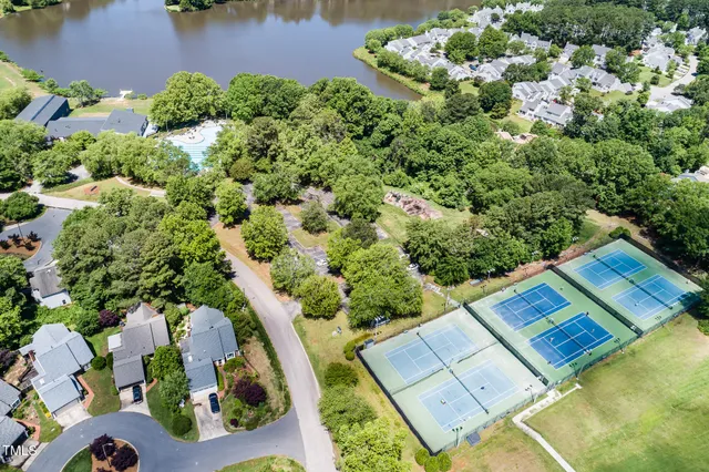 an aerial view of a house swimming pool and outdoor space