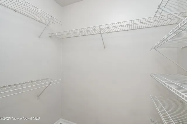 a view of a room with racks on the wall