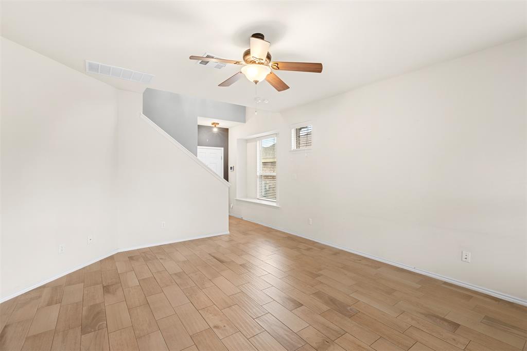3560 Pauling Loop Round Rock, TX 78665 - Photo 21 of 28 Unfurnished room with a ceiling fan and wood tiled floors