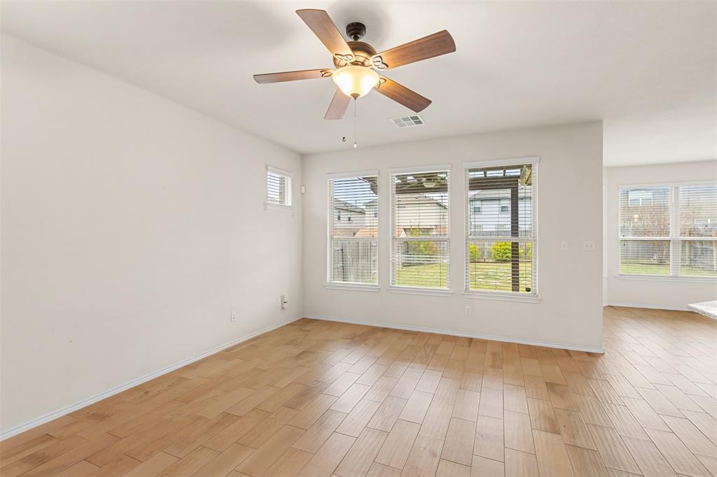 3560 Pauling Loop Round Rock, TX 78665 - Photo 22 of 28 Unfurnished room with wood finish floors and a ceiling fan