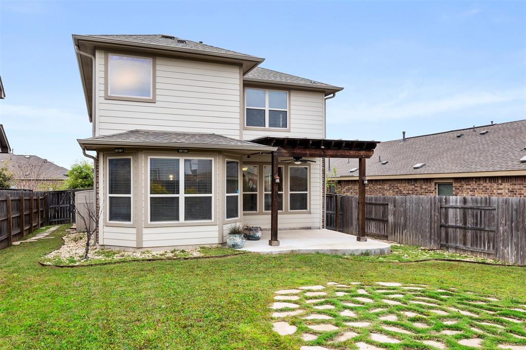 3560 Pauling Loop Round Rock, TX 78665 - Photo 26 of 28 Back of property with a patio area, a fenced backyard, a pergola, and ceiling fan