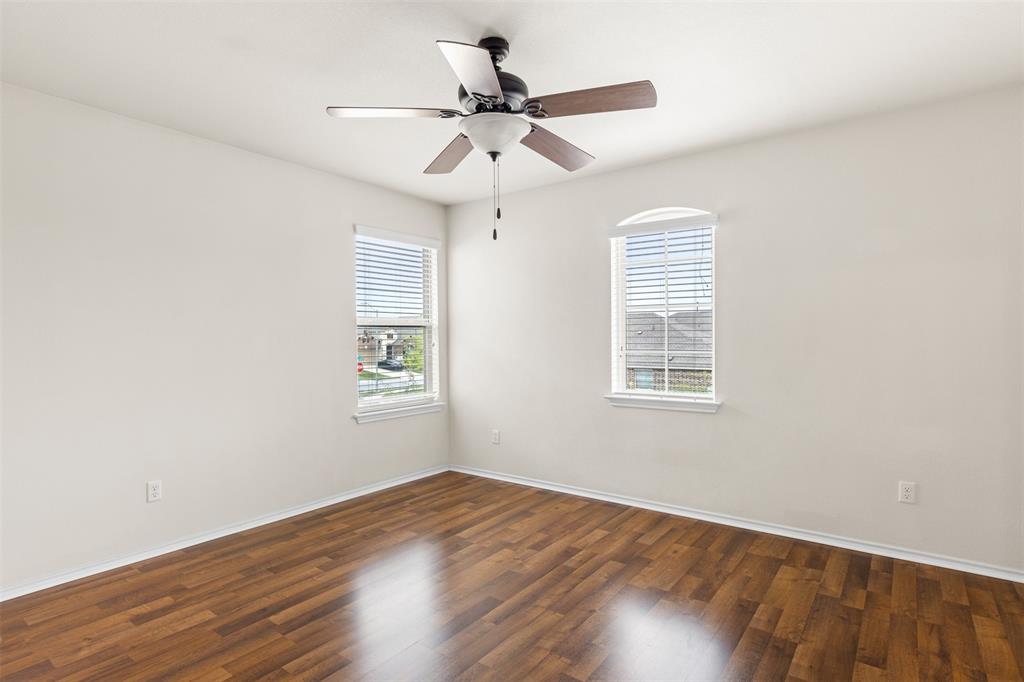 3560 Pauling Loop Round Rock, TX 78665 - Photo 5 of 28 Spare room with dark wood-style floors and ceiling fan