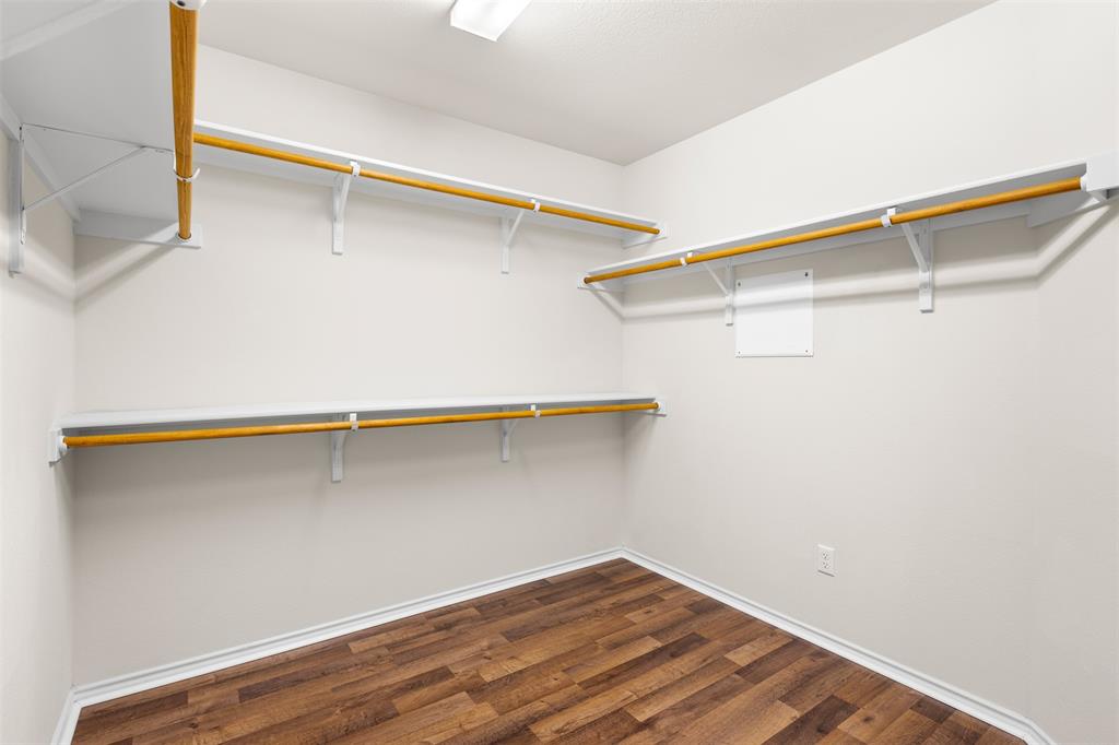 3560 Pauling Loop Round Rock, TX 78665 - Photo 6 of 28 Walk in closet with dark wood-style floors