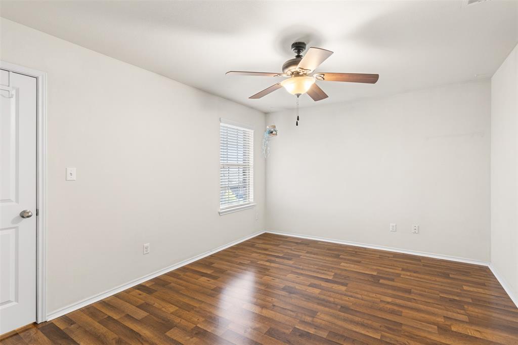 3560 Pauling Loop Round Rock, TX 78665 - Photo 7 of 28 Empty room with dark wood-type flooring and a ceiling fan