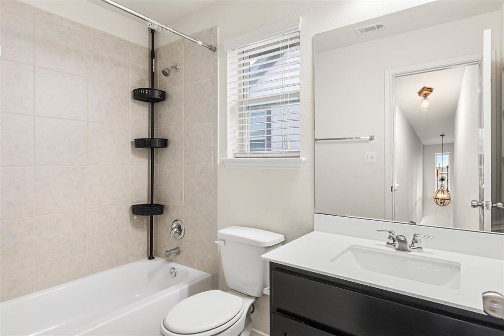 3560 Pauling Loop Round Rock, TX 78665 - Photo 8 of 28 Full bathroom featuring vanity and bathing tub / shower combination