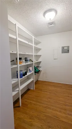 a view of an empty room with empty shelves