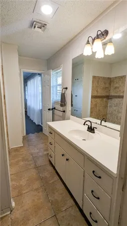 a view of empty room with ceiling fan