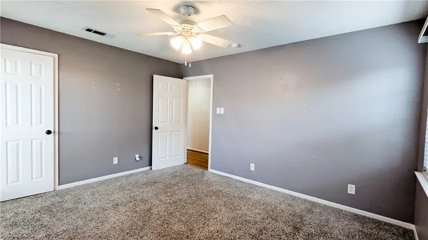 a spacious bathroom with a double vanity sink and mirror