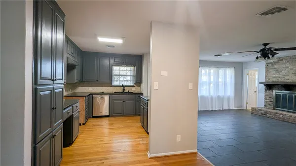 a view of a kitchen cabinets and wooden floor