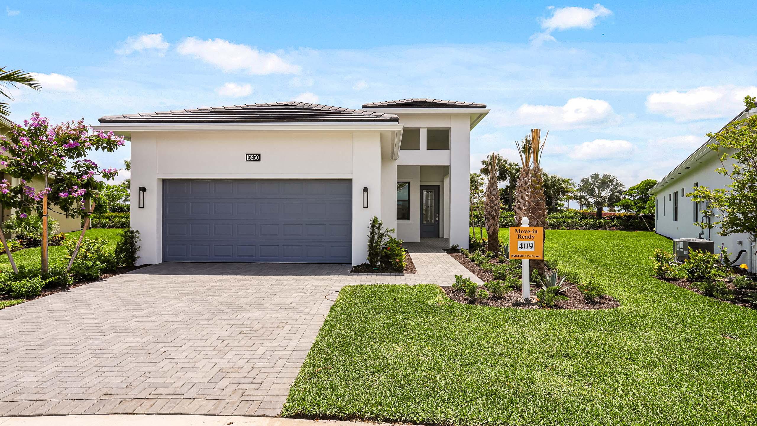 a view of a house with backyard and porch