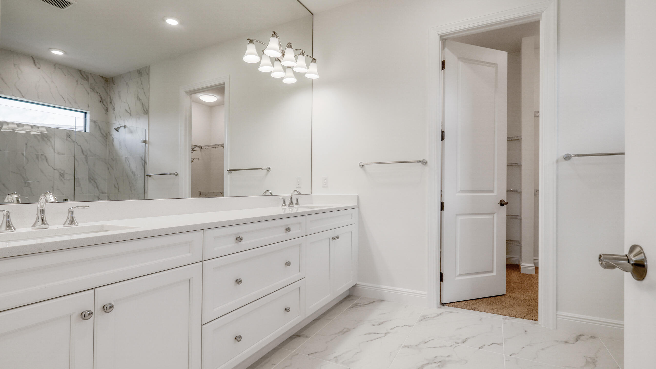 15850 Alys Terrace Westlake, FL 33470 - Photo 12 of 26 a bathroom with double sink and a mirror