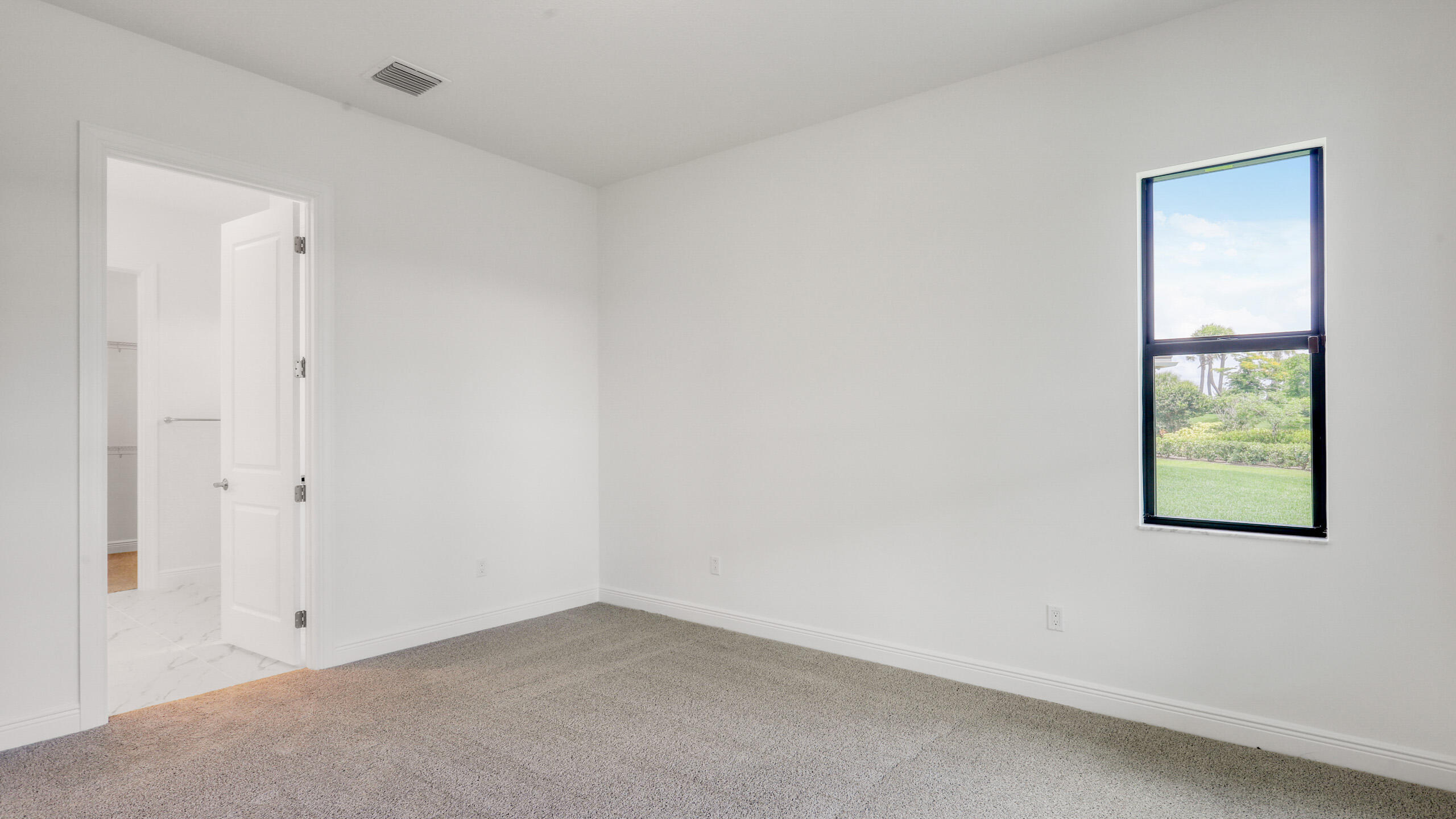 15850 Alys Terrace Westlake, FL 33470 - Photo 15 of 26 an empty room with a window