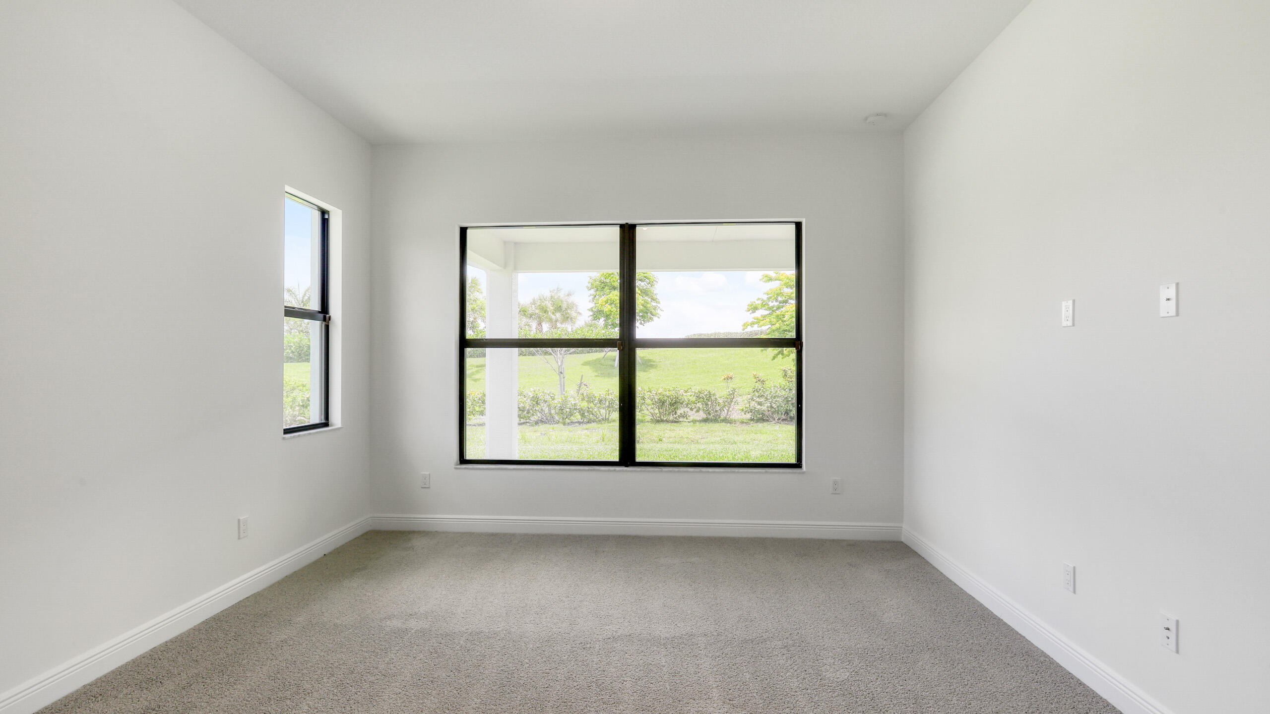 15850 Alys Terrace Westlake, FL 33470 - Photo 18 of 26 an empty room with a window