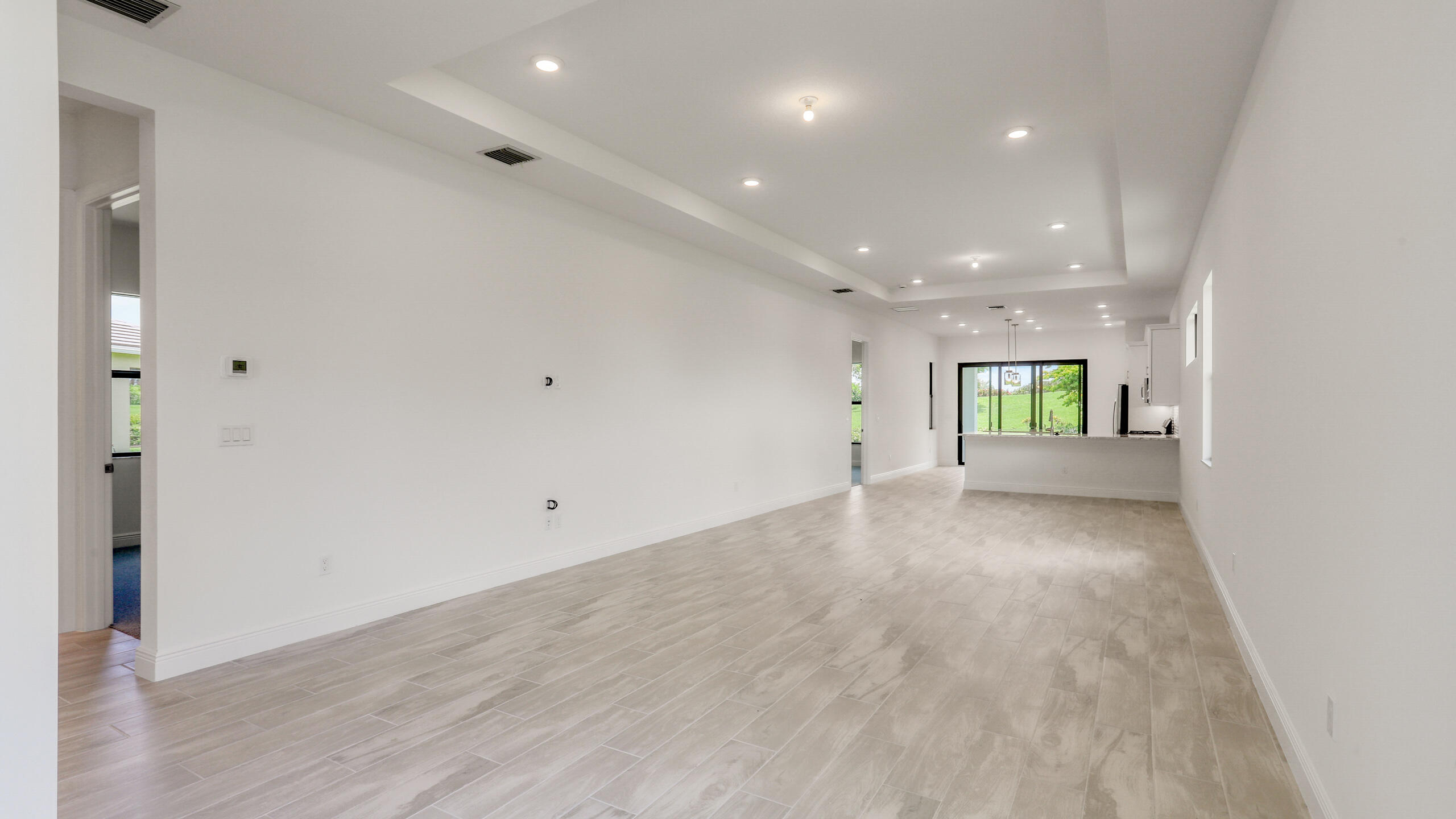 15850 Alys Terrace Westlake, FL 33470 - Photo 7 of 26 a view of an empty room with a window