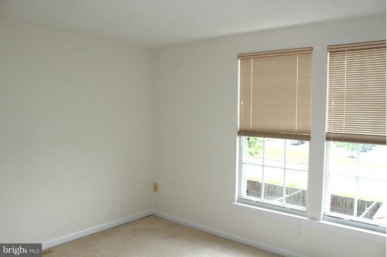2243 Riding Crop Way Windsor Mill, MD 21244 - Photo 8 of 12 an empty room with a window
