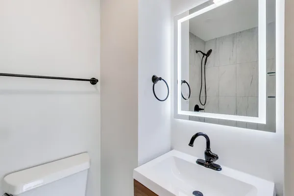 a bathroom with a sink and mirror