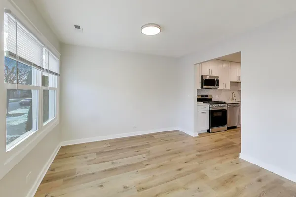 a view of a kitchen with a sink and dishwasher cabinets