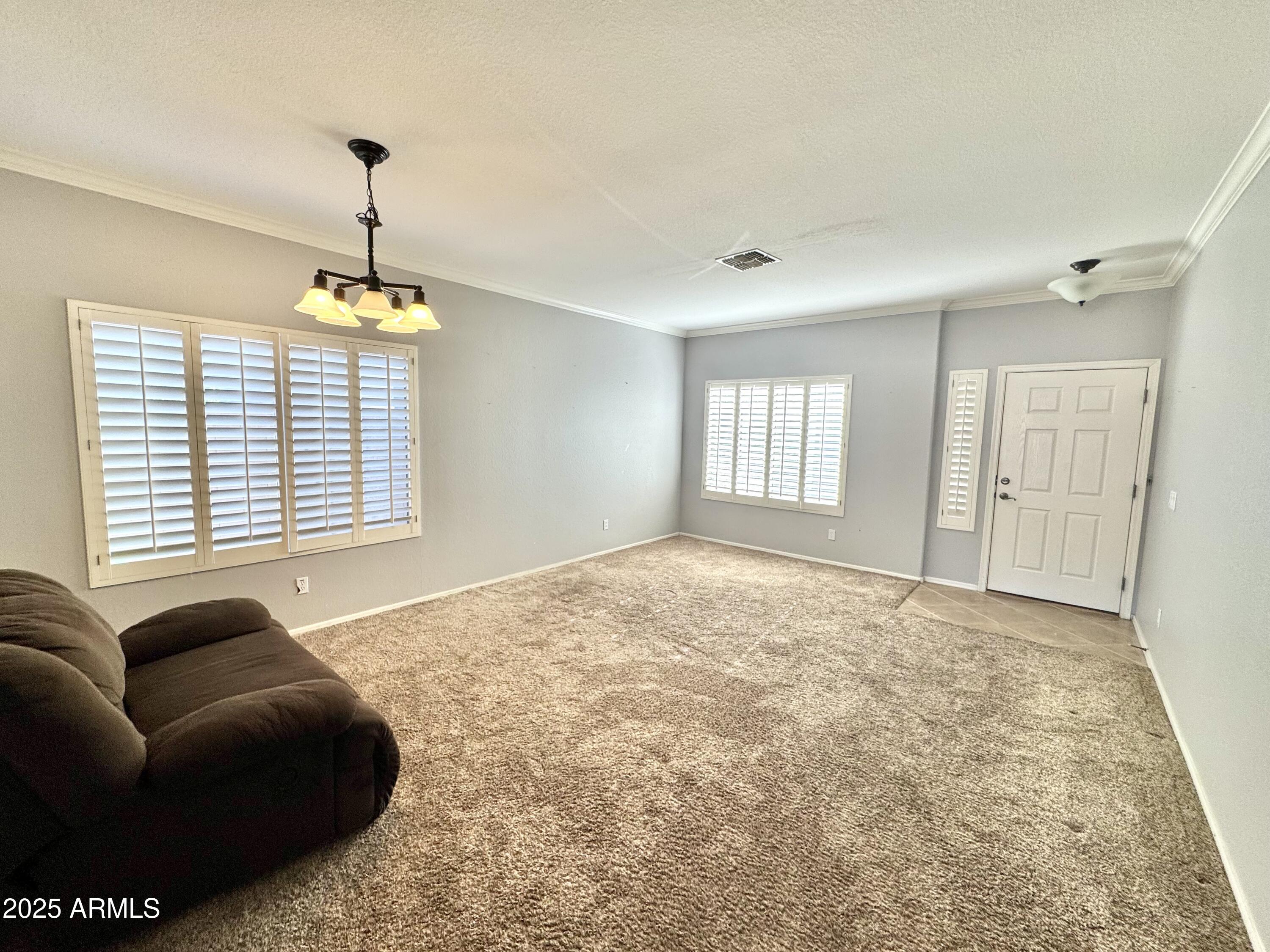 44518 Redrock Road Maricopa, AZ 85139 - Photo 4 of 14 a spacious bedroom with a bed and a window