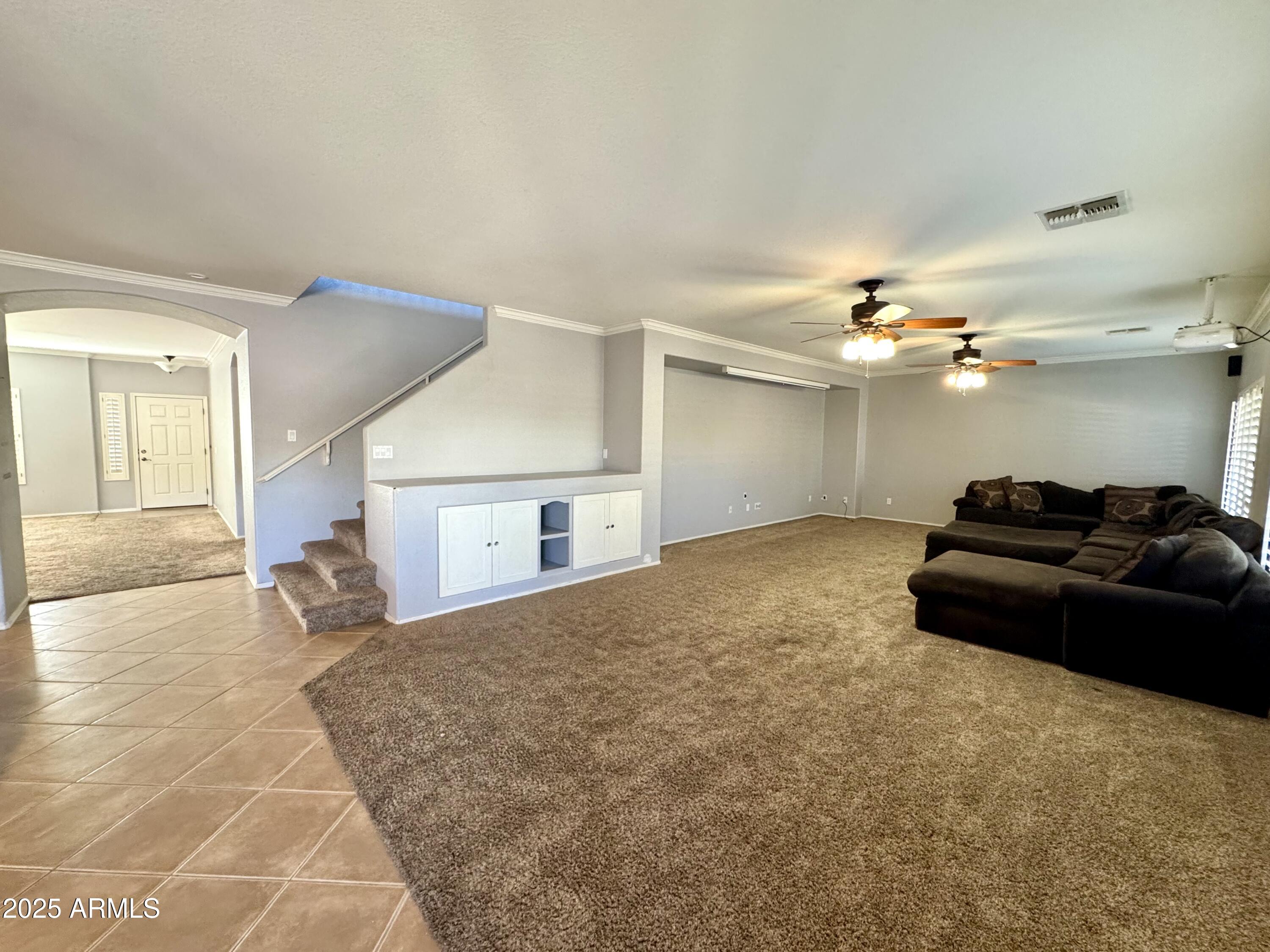 44518 Redrock Road Maricopa, AZ 85139 - Photo 7 of 14 a bedroom with a bed and cabinets