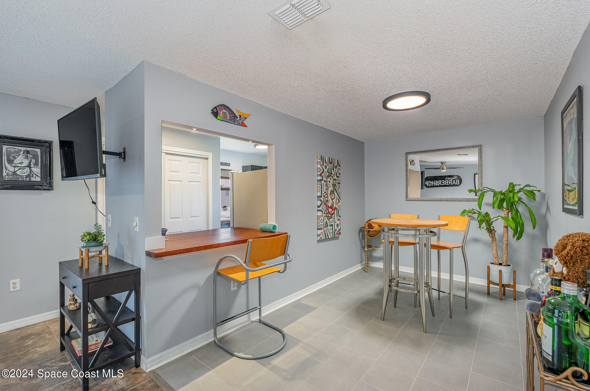 280 Spring Drive, Unit 4 Merritt Island, FL 32953 - Photo 11 of 32 a dining room with a table and chairs