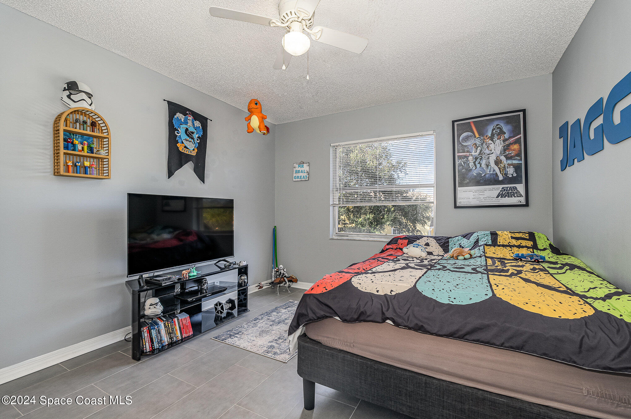 280 Spring Drive, Unit 4 Merritt Island, FL 32953 - Photo 22 of 32 a living room with furniture and a flat screen tv